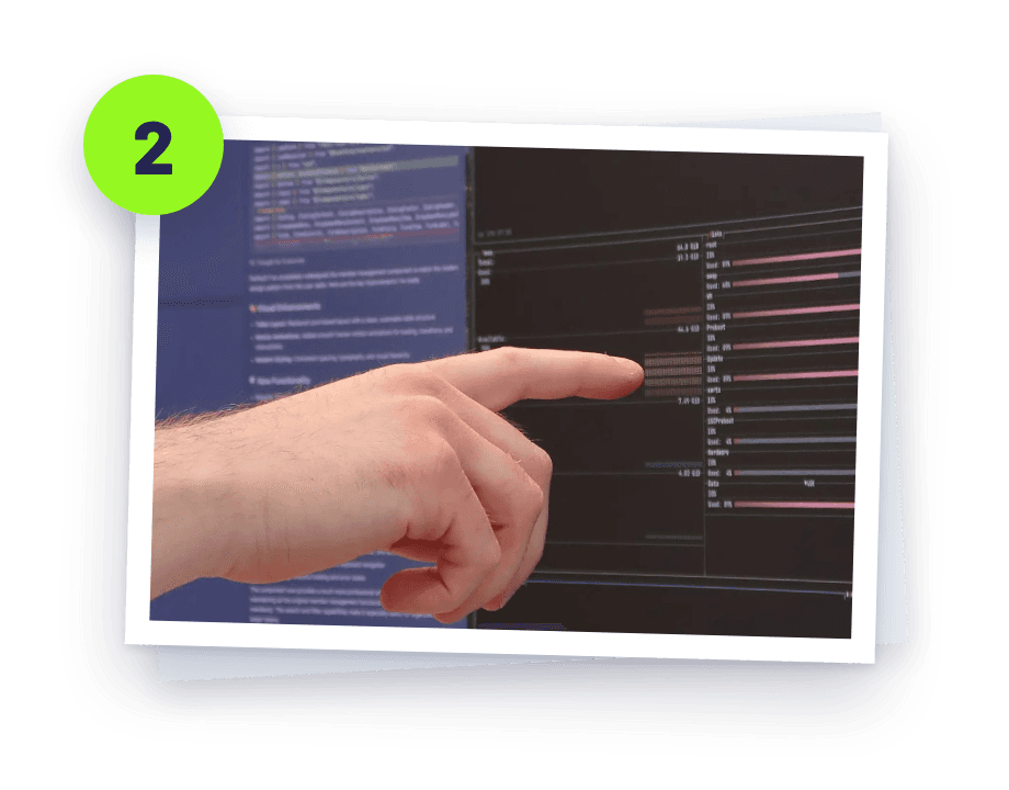 Someone pointing at code on a screen